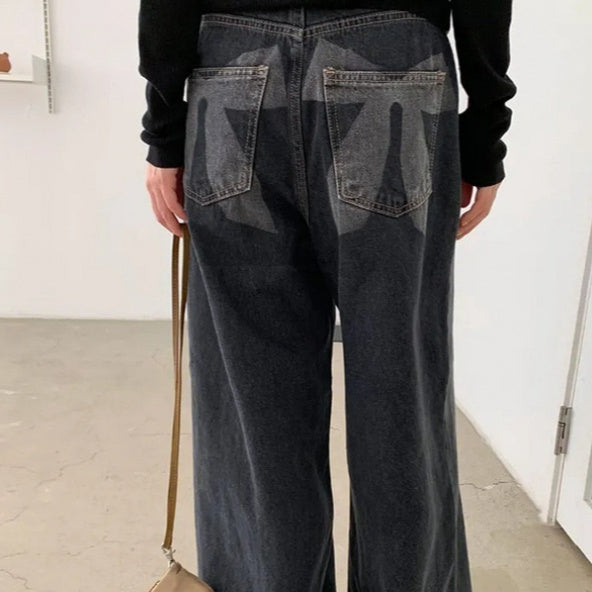Washed And Worn Wide Leg Jeans With Bow Print At The Back